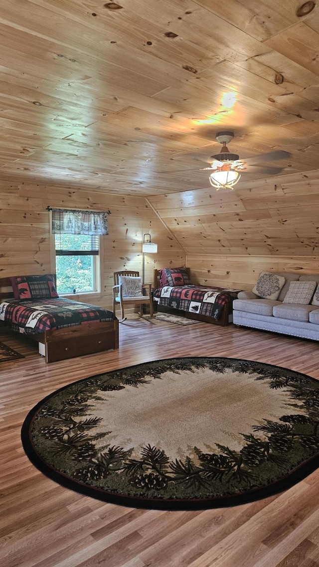 67 Upper Narrows Rd, Long Pond Twp, ME 04945 - bedroom with wood finished floors, wood ceiling, and wood walls