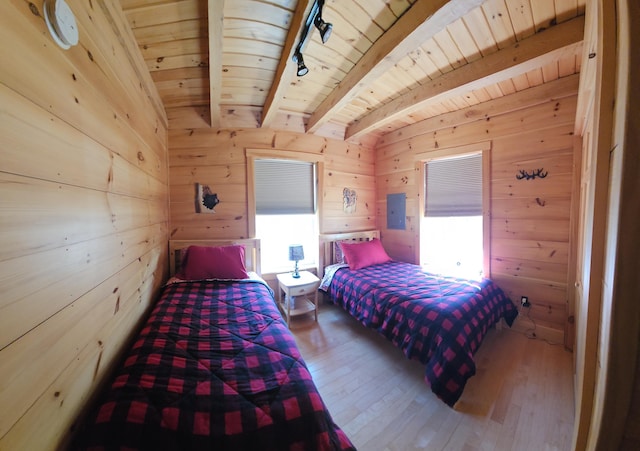 67 Upper Narrows Rd, Long Pond Twp, ME 04945 - bedroom featuring a wood ceiling with exposed beams, wood walls, wood-type flooring, and electric panel