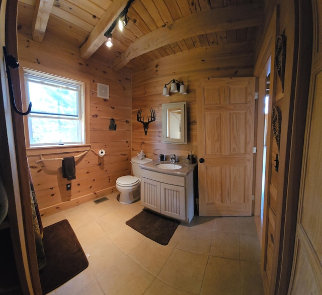 67 Upper Narrows Rd, Long Pond Twp, ME 04945 - bathroom featuring wooden walls, track lighting, a wood ceiling with exposed beams, vanity, and tile patterned floors