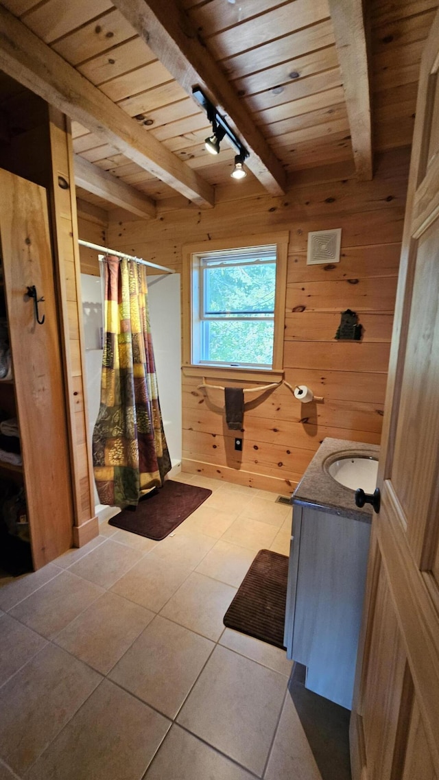 67 Upper Narrows Rd, Long Pond Twp, ME 04945 - full bathroom featuring a wooden ceiling with exposed beams, wooden walls, rail lighting, vanity, and curtained shower