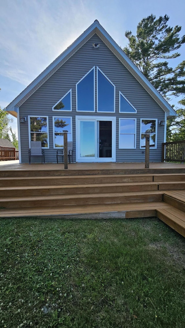 67 Upper Narrows Rd, Long Pond Twp, ME 04945 - rear view of house with a deck and a yard