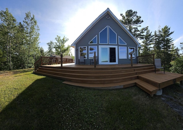 67 Upper Narrows Rd, Long Pond Twp, ME 04945 - rear view of house with a lawn and a deck