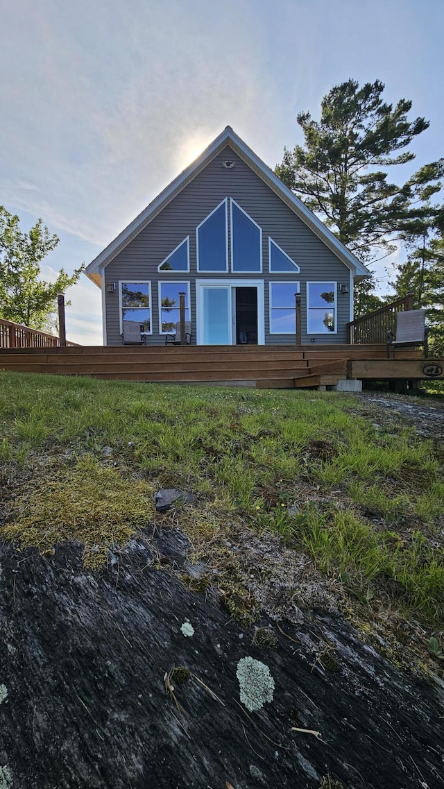 67 Upper Narrows Rd, Long Pond Twp, ME 04945 - rear view of property with a wooden deck