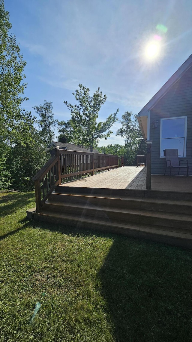 67 Upper Narrows Rd, Long Pond Twp, ME 04945 - wooden deck featuring a lawn