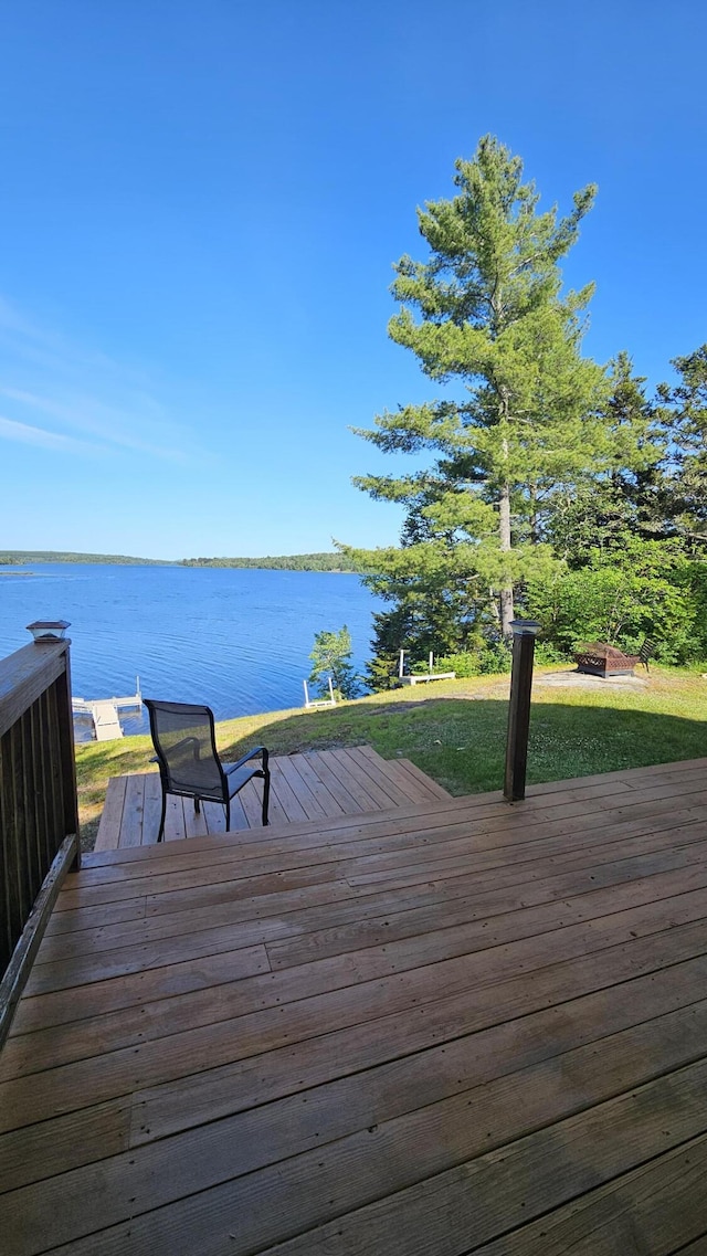 67 Upper Narrows Rd, Long Pond Twp, ME 04945 - deck with a water view and a lawn