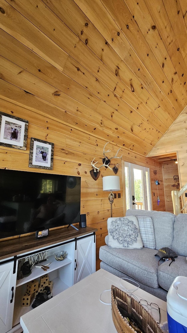 67 Upper Narrows Rd, Long Pond Twp, ME 04945 - living room featuring wood walls, vaulted ceiling, and wooden ceiling