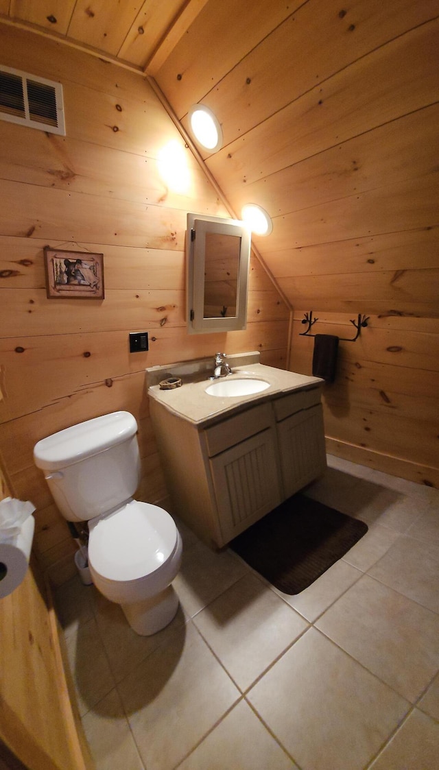 67 Upper Narrows Rd, Long Pond Twp, ME 04945 - half bathroom with vaulted ceiling, tile patterned floors, wood walls, vanity, and wooden ceiling