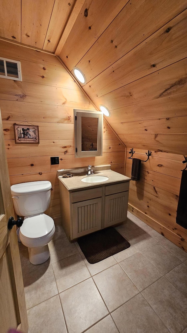 67 Upper Narrows Rd, Long Pond Twp, ME 04945 - bathroom featuring lofted ceiling, wood walls, wood ceiling, vanity, and tile patterned floors