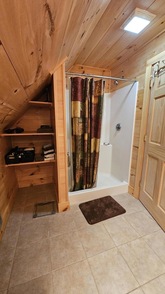 67 Upper Narrows Rd, Long Pond Twp, ME 04945 - full bath featuring lofted ceiling, a shower stall, wood walls, tile patterned floors, and wooden ceiling