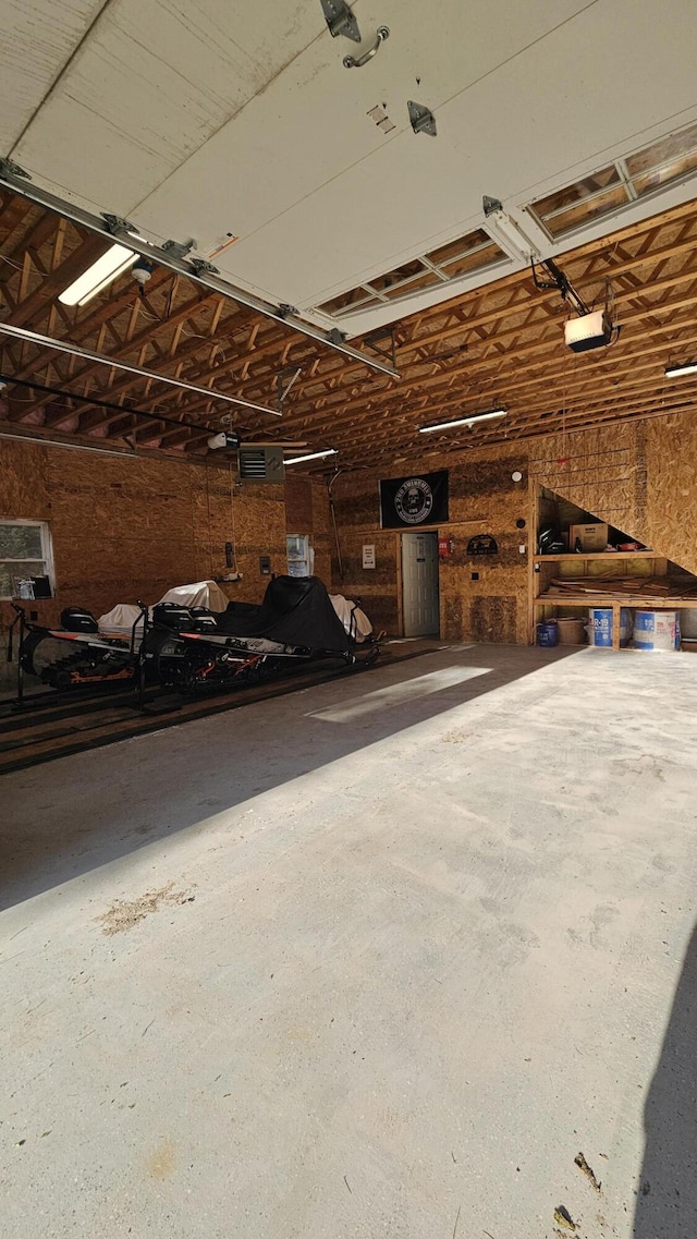 67 Upper Narrows Rd, Long Pond Twp, ME 04945 - garage featuring a garage door opener