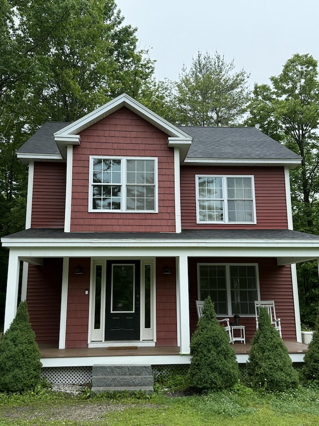 21 Pike Hill Rd, Naples, ME 04055 - view of front of home with a porch and roof with shingles