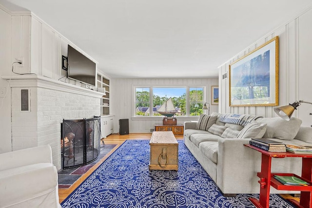 555 Pool St, Biddeford, ME 04005 - living area featuring wood finished floors and a fireplace