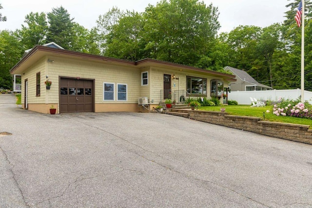 1522 Richville Rd, Standish, ME 04084 - single story home featuring a garage, asphalt driveway, and view of scattered trees