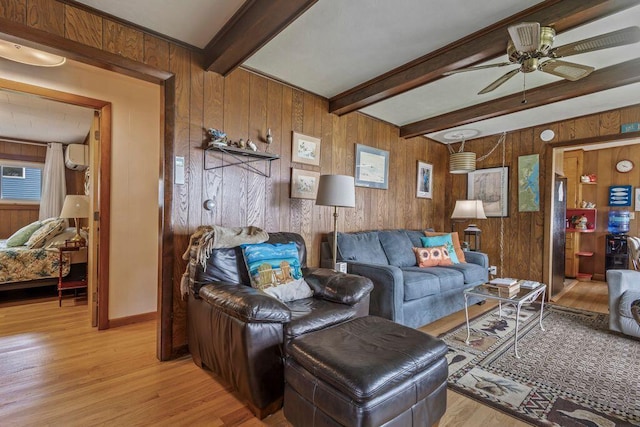 1522 Richville Rd, Standish, ME 04084 - living area featuring wood walls, light wood-style flooring, ceiling fan, and beam ceiling