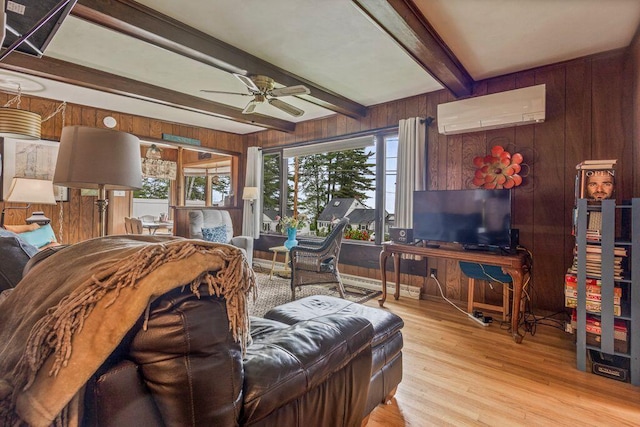 1522 Richville Rd, Standish, ME 04084 - living area featuring an AC wall unit, wood walls, a ceiling fan, beamed ceiling, and wood finished floors