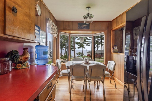 1522 Richville Rd, Standish, ME 04084 - dining room featuring wood walls and light wood-style flooring