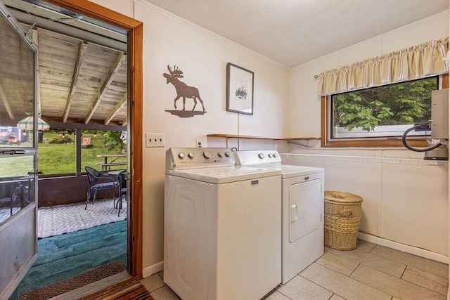 1522 Richville Rd, Standish, ME 04084 - laundry area featuring washing machine and clothes dryer, ornamental molding, and light tile patterned floors