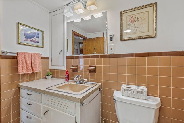 1522 Richville Rd, Standish, ME 04084 - bathroom with vanity, tile walls, crown molding, and wainscoting