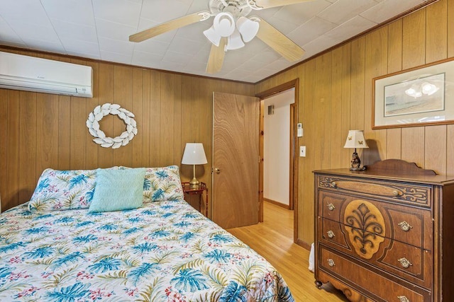 1522 Richville Rd, Standish, ME 04084 - bedroom with a wall unit AC, wooden walls, light wood-style floors, and a ceiling fan