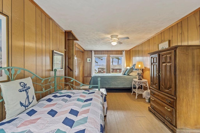 1522 Richville Rd, Standish, ME 04084 - bedroom featuring wooden walls, light wood-type flooring, crown molding, and ceiling fan