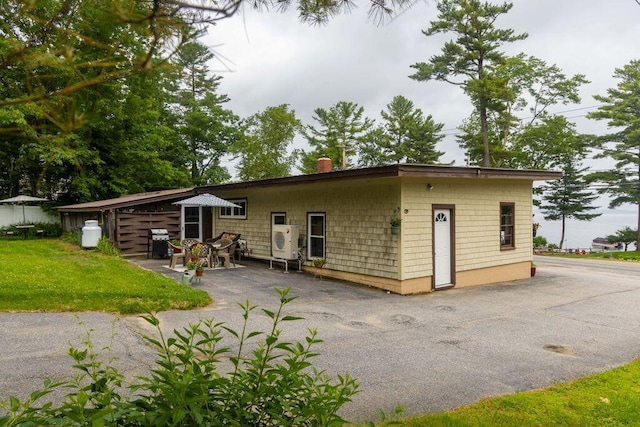 1522 Richville Rd, Standish, ME 04084 - rear view of property with a patio area, a chimney, and a lawn
