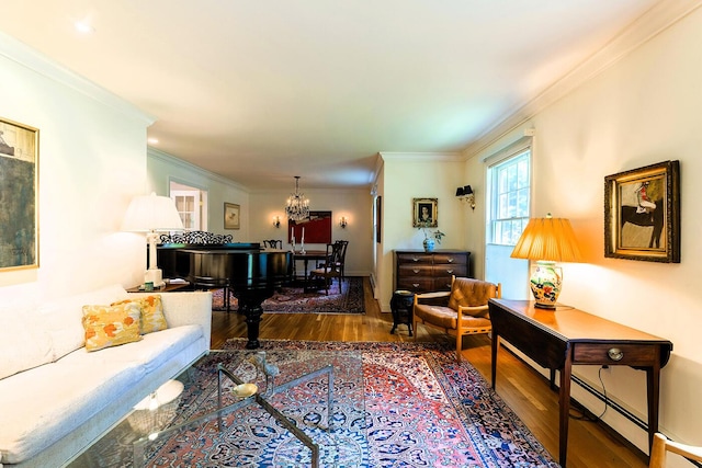 42 Stonehurst Dr, Camden, ME 04843 - living room with wood finished floors, crown molding, and a chandelier