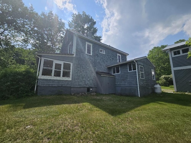 28 Varnum Pond Rd, Temple, ME 04984 - rear view of property with a storage shed and a yard