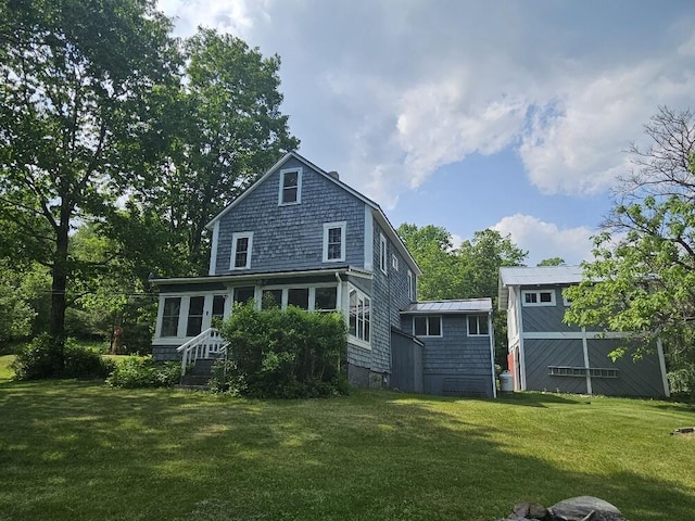 28 Varnum Pond Rd, Temple, ME 04984 - rear view of house featuring a lawn