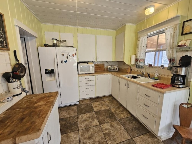 28 Varnum Pond Rd, Temple, ME 04984 - kitchen with white appliances, crown molding, tasteful backsplash, dark stone finish floors, and butcher block countertops