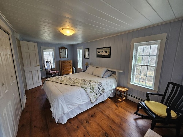 28 Varnum Pond Rd, Temple, ME 04984 - bedroom featuring crown molding, dark wood-type flooring, and a baseboard heating unit