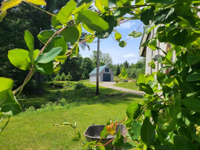 163 Ayer Ridge Rd, Freedom, ME 04941 - view of grassy yard with an outbuilding and a fire pit