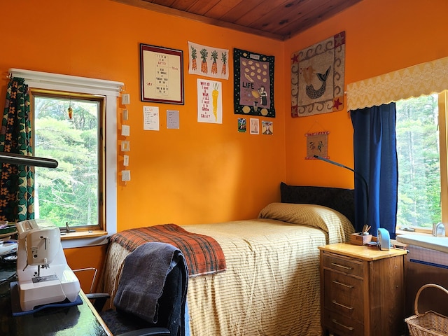 163 Ayer Ridge Rd, Freedom, ME 04941 - bedroom with multiple windows and wood ceiling