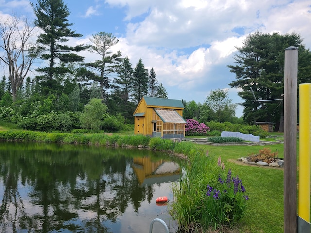 163 Ayer Ridge Rd, Freedom, ME 04941 - view of green lawn with an outdoor structure and a water view