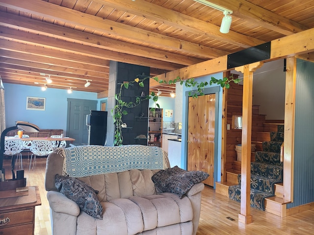 163 Ayer Ridge Rd, Freedom, ME 04941 - living area with a wood ceiling with exposed beams, light wood-style floors, and stairs