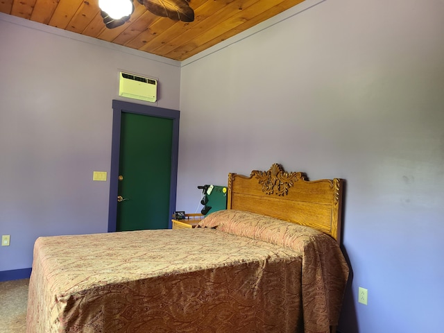 163 Ayer Ridge Rd, Freedom, ME 04941 - bedroom with a wall unit AC, wooden ceiling, and carpet floors