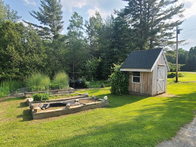 163 Ayer Ridge Rd, Freedom, ME 04941 - view of grassy yard featuring a garden and a shed