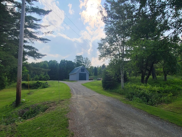 163 Ayer Ridge Rd, Freedom, ME 04941 - view of dirt / gravel road with a barn and a wooded view