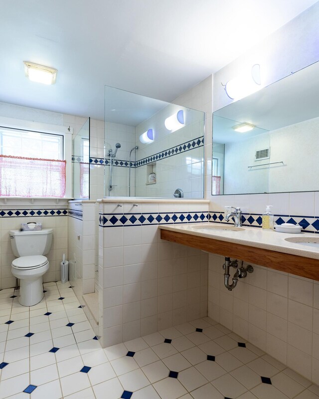 184 Mountain St, Camden, ME 04843 - bathroom featuring tile walls, tile patterned floors, and walk in shower
