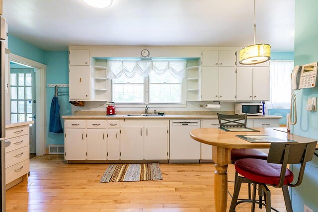 184 Mountain St, Camden, ME 04843 - kitchen featuring white appliances, open shelves, plenty of natural light, and light wood-type flooring