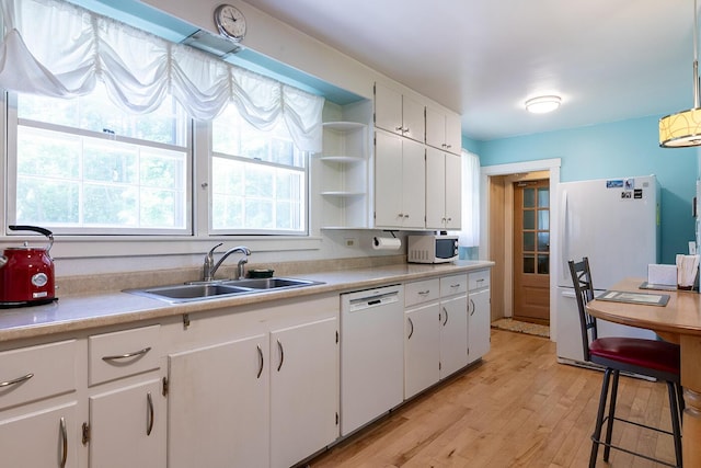 184 Mountain St, Camden, ME 04843 - kitchen featuring white appliances, light wood-style floors, open shelves, white cabinetry, and light countertops