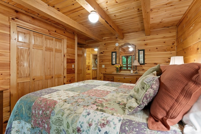 50 Flagg Way, Fayette, ME 04349 - bedroom with wood walls and a wooden ceiling with exposed beams