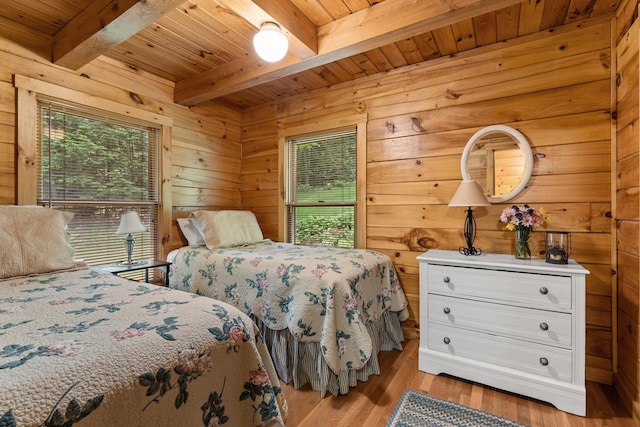 50 Flagg Way, Fayette, ME 04349 - bedroom featuring a wood ceiling with exposed beams, multiple windows, wood finished floors, and wood walls