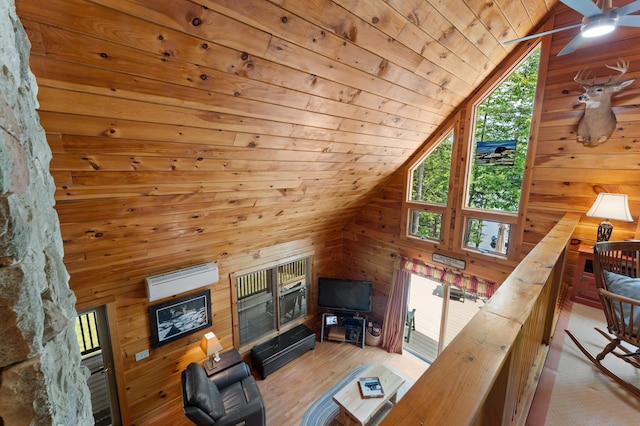 50 Flagg Way, Fayette, ME 04349 - living area featuring wooden ceiling, lofted ceiling, an AC wall unit, wood walls, and a ceiling fan