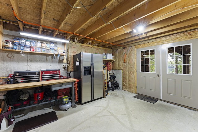 50 Flagg Way, Fayette, ME 04349 - below grade area featuring stainless steel fridge and a workshop area