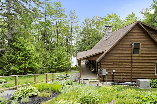 50 Flagg Way, Fayette, ME 04349 - view of property exterior with log exterior and a chimney