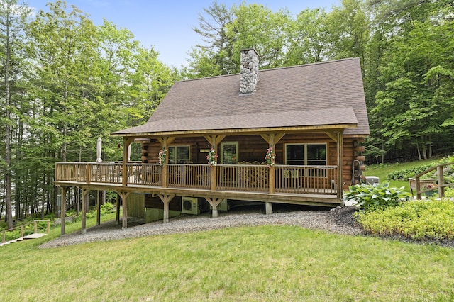 50 Flagg Way, Fayette, ME 04349 - rear view of house with log exterior, a shingled roof, and a wooden deck
