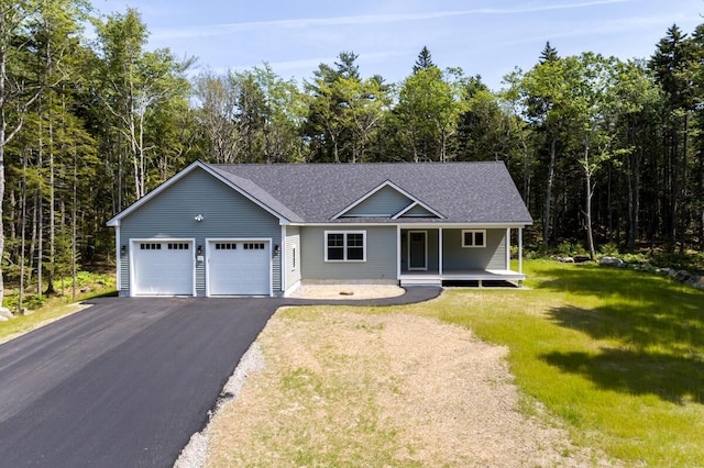 59 Sagamore Dr Lot 28, Phippsburg, ME 04562 - view of front of home featuring a garage, covered porch, driveway, a front lawn, and a shingled roof
