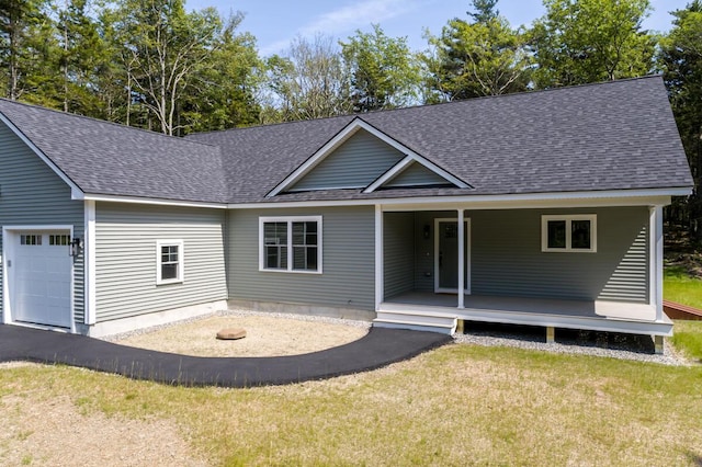59 Sagamore Dr Lot 28, Phippsburg, ME 04562 - view of front of property featuring a shingled roof, an attached garage, a front yard, and covered porch
