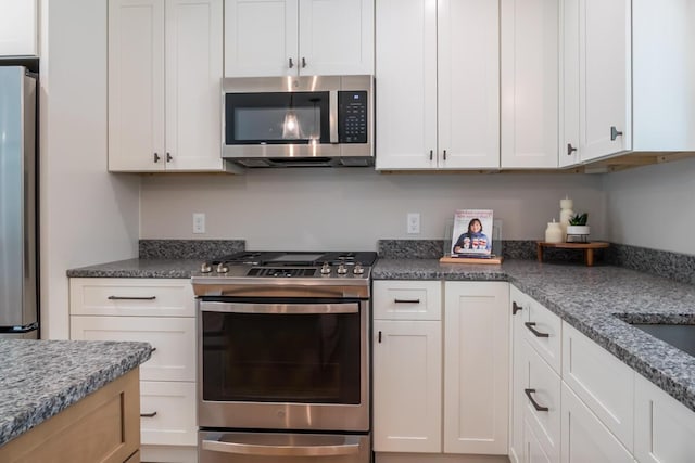 59 Sagamore Dr Lot 28, Phippsburg, ME 04562 - kitchen featuring stainless steel appliances, white cabinets, and dark stone counters