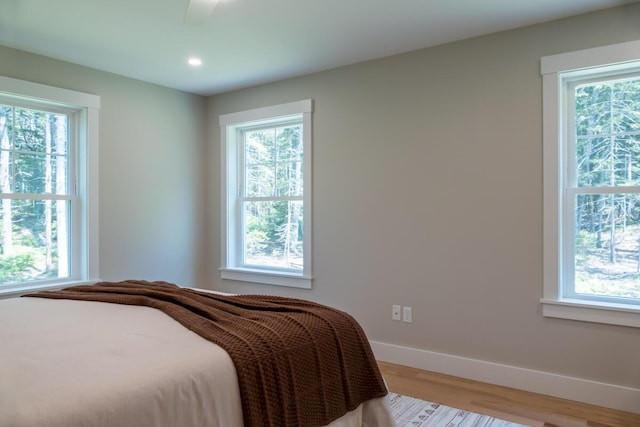 59 Sagamore Dr Lot 28, Phippsburg, ME 04562 - bedroom with multiple windows, wood finished floors, and recessed lighting